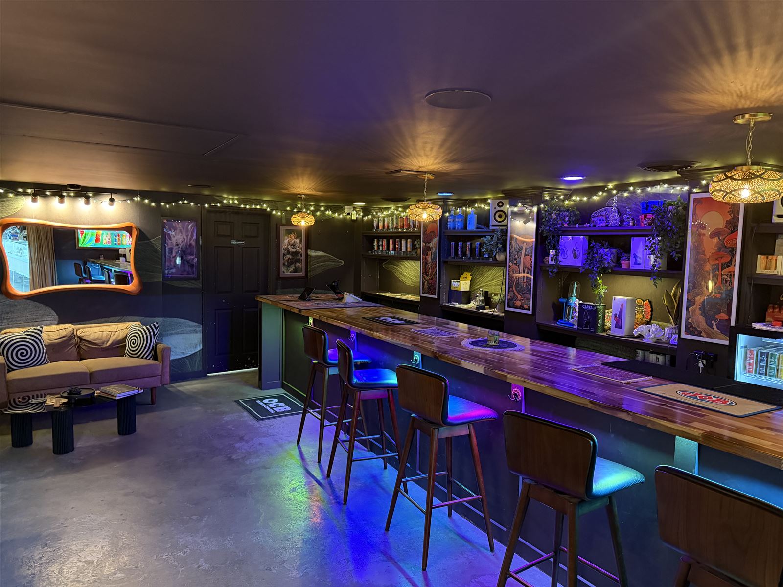 The lounge at Marley's — bar seating, couches and string lights